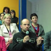 A group of researchers and scientists promoting open access at a meeting. 