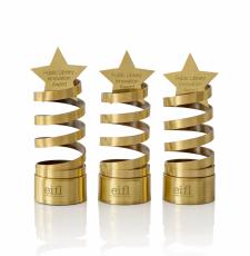 Three brass trophies, a virtical spiral with a star on top.