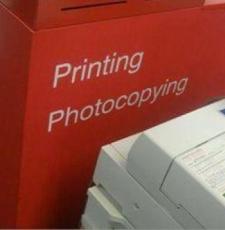 Image of a book next to a printer, to represent copying. Source: Monash University Malaysia: https://www.monash.edu.my/library/services-facilities/computing/printing