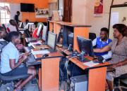 People in Mbale Public Library in Uganda, learning how to use computers.