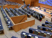 Scene from nearly empty hall during SCCR/40 in 2020 which took place in hybrid mode, with only Geneva-based delegates present, and everyone else participating remotely because of COVID-19.