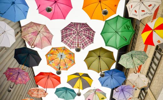 mage from the course - multicoloured umbrellas in the sky, representing data protection.