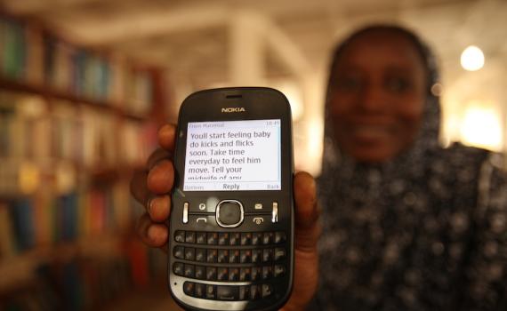 Women received advice and encouragement through the simplest of devices — their mobile phones. Photo credit: Iain Marlow